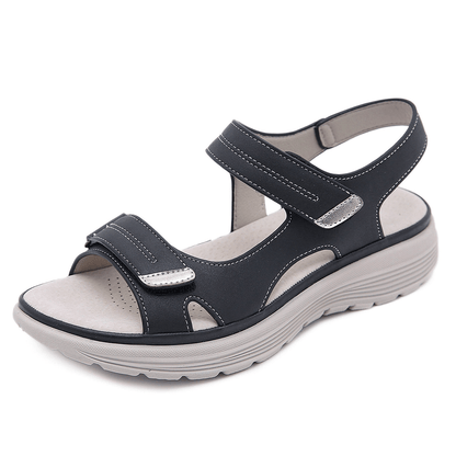 Black velcro sandal with wide toe design and white sole