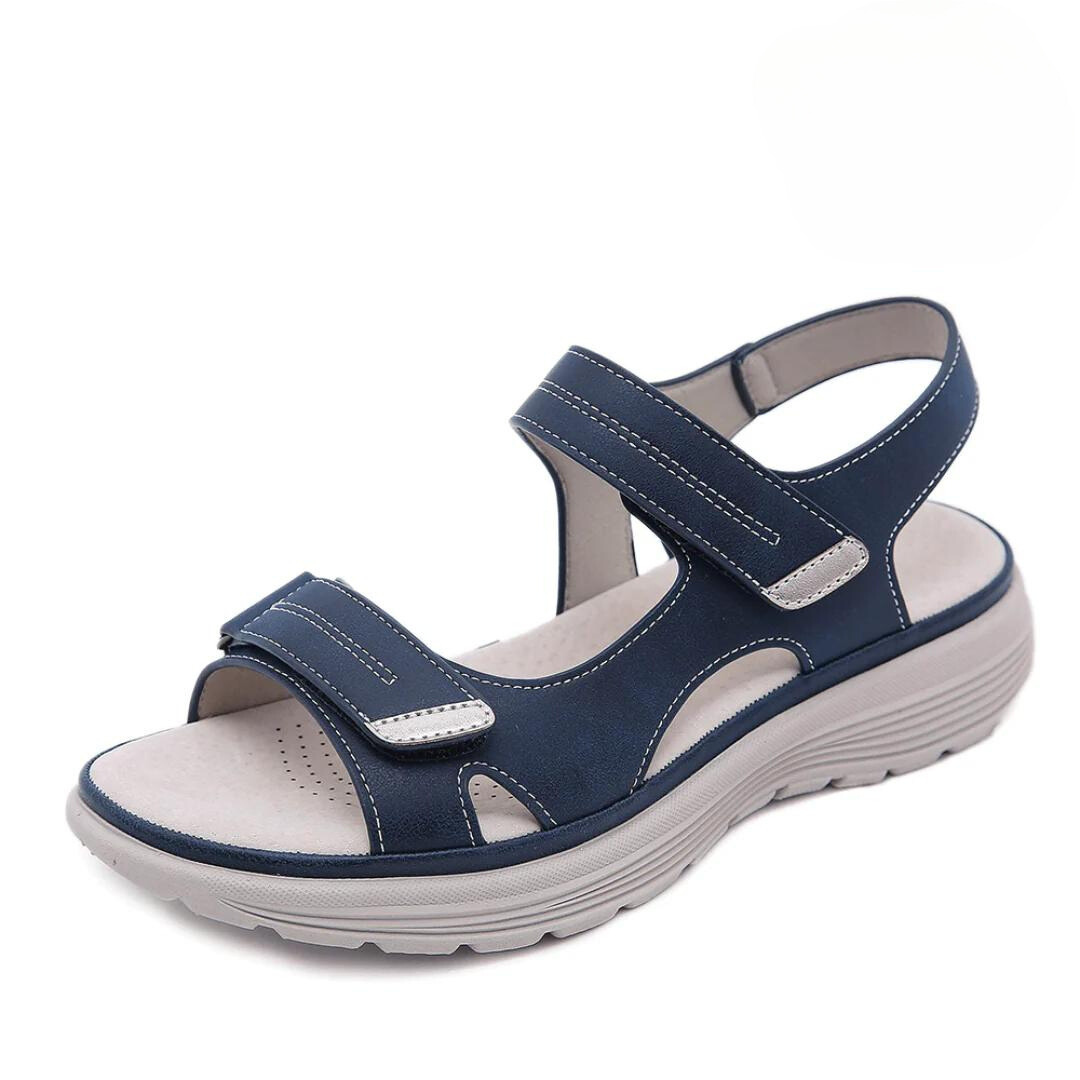 Navy blue velcro sandal with wide toe box and cushioned sole