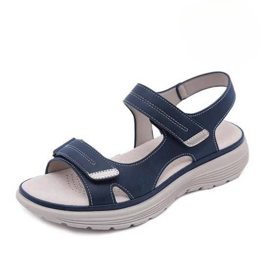 Navy blue velcro sandal with wide toe box and cushioned sole