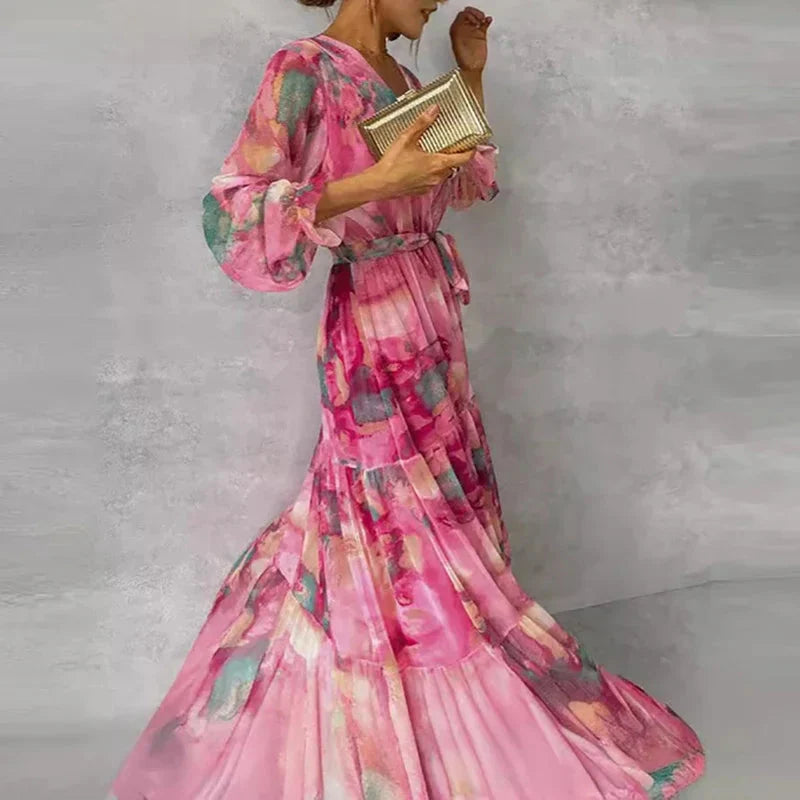 Side profile of pink floral maxi dress showing puffed sleeve and layered skirt