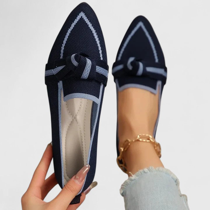 Navy blue pointed toe slip-on loafer with periwinkle bow knot and trim detail