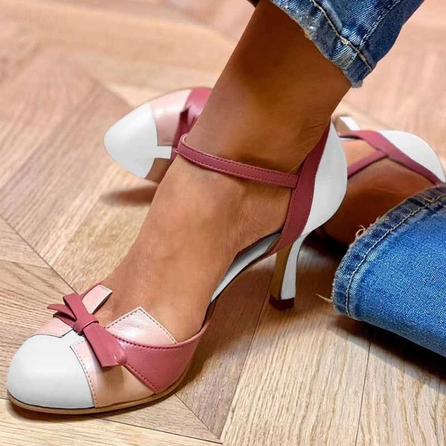 Multicolor block toe stiletto heels featuring pink, white, and beige sections with bow detail and ankle strap