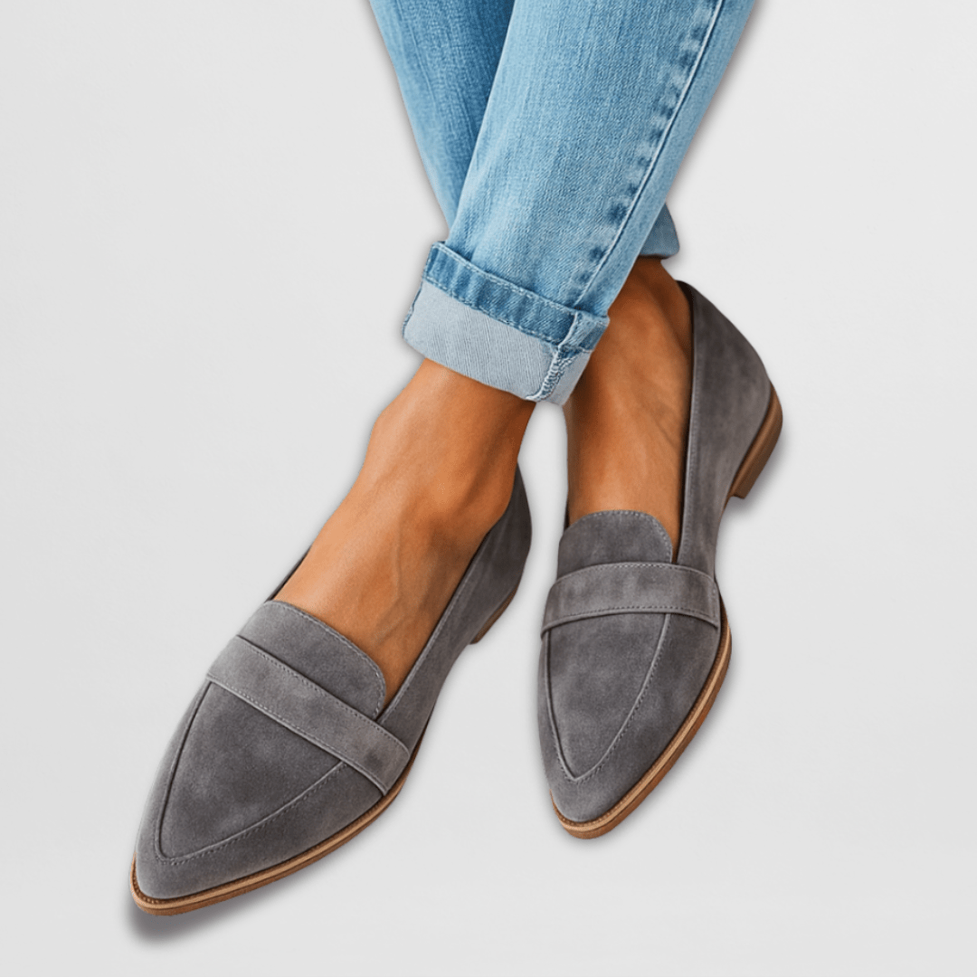 Gray suede pointed loafer flats with band strap styled with cuffed denim