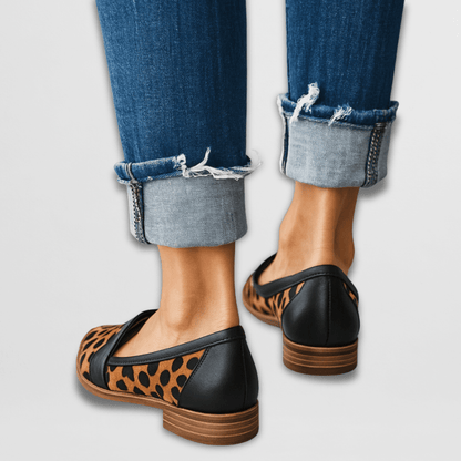 Leopard suede pointed loafer flats back view showing stacked wooden heel