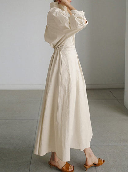 Side profile of cream puffed sleeve wrap dress showing gathered fabric detail