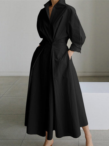 Black wrap v-neck midi dress with oversized puffed sleeves, front view