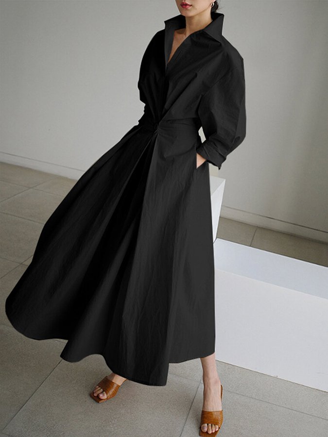 Black wrap midi dress with billowing puffed sleeves and flowing skirt