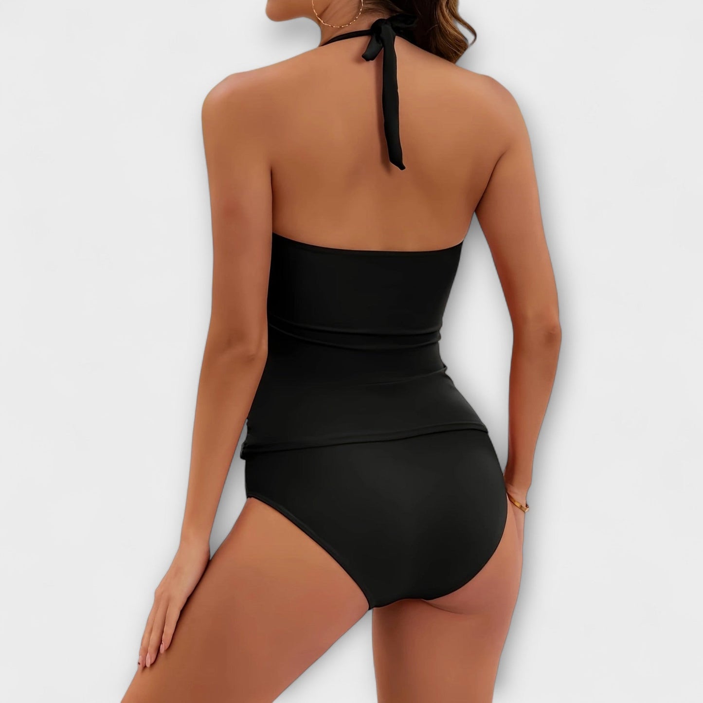 Back view of black halter swimsuit with tied neck strap
