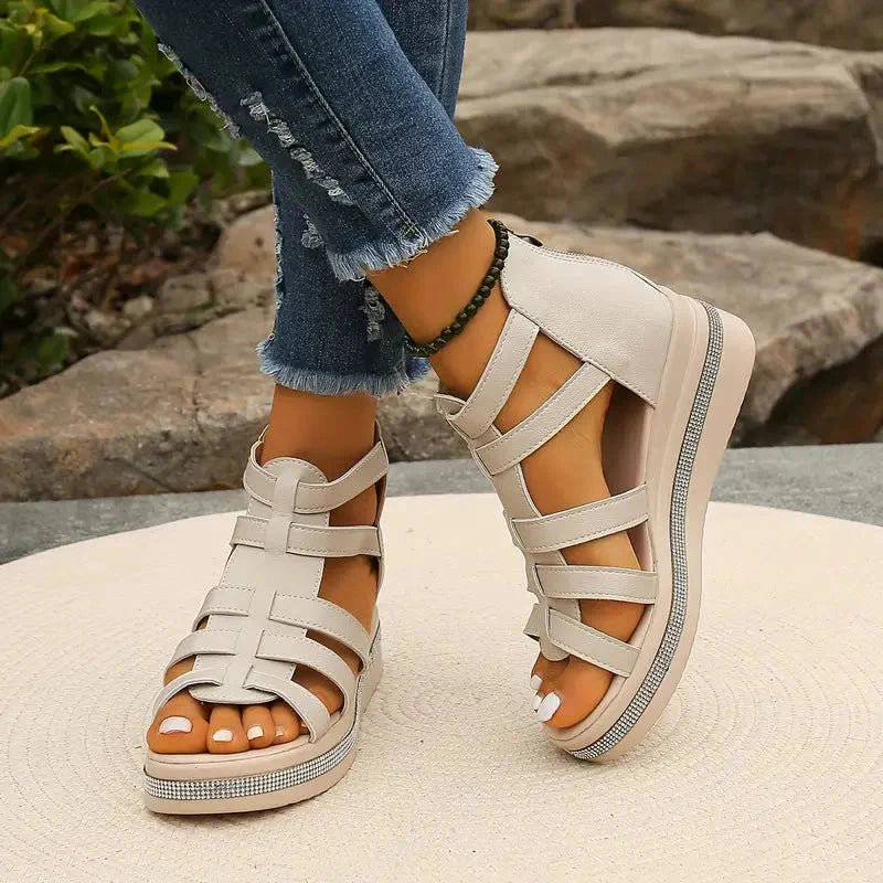Beige strappy platform sandals with rhinestone sole detail and white leather straps
