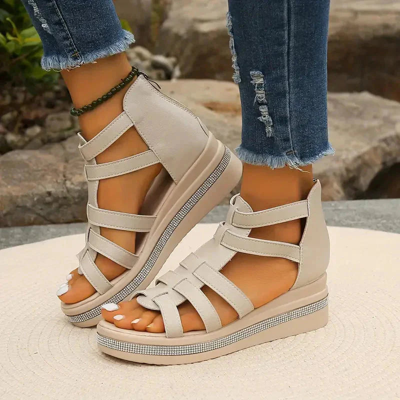 Beige strappy platform sandals with rhinestone trim and white leather ankle straps