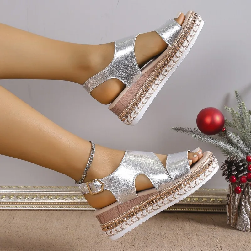 Silver metallic platform sandals with ankle strap, overhead angle view