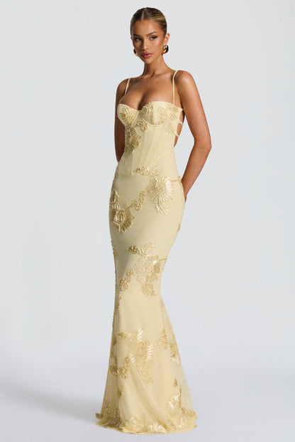 Cream maxi dress with gold floral appliqué and cutout side detail front