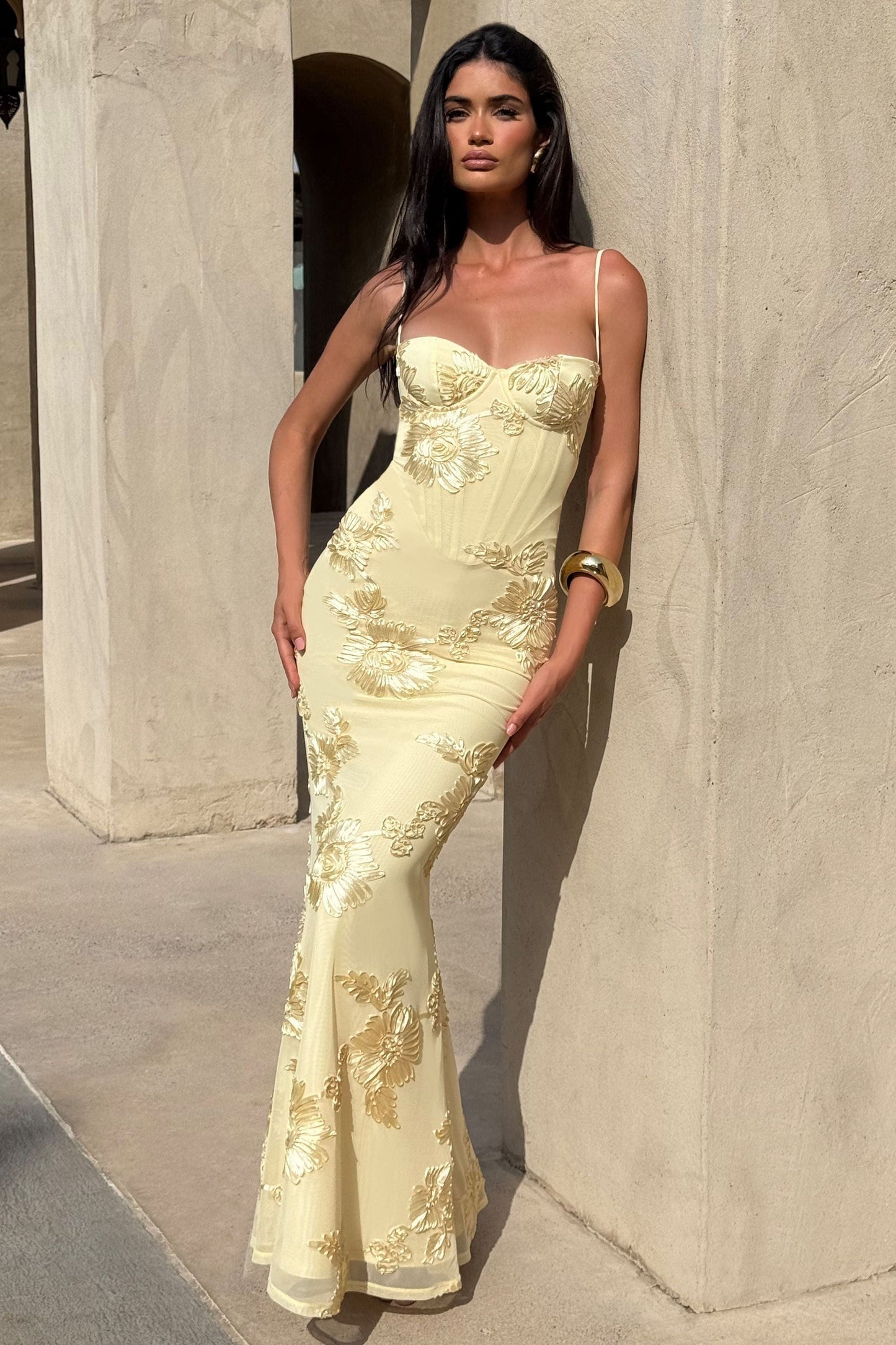 Cream maxi dress with gold floral embroidery and sweetheart bodice lifestyle