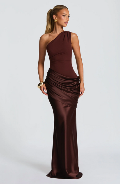 Burgundy satin one-shoulder maxi dress with draped bodice and side slit, side view