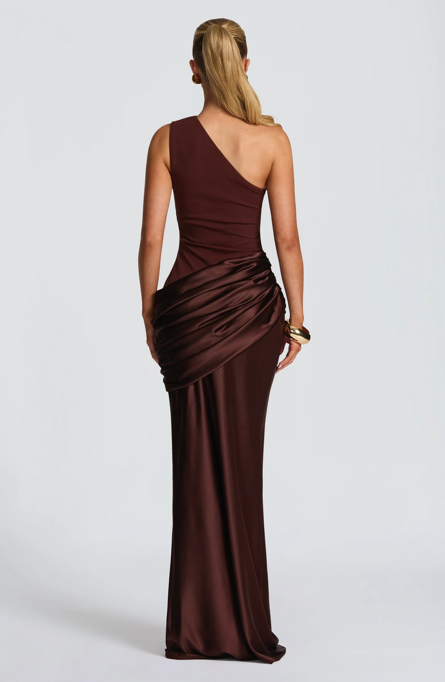 One-shoulder satin maxi dress back view showing asymmetrical neckline and floor-length silhouette