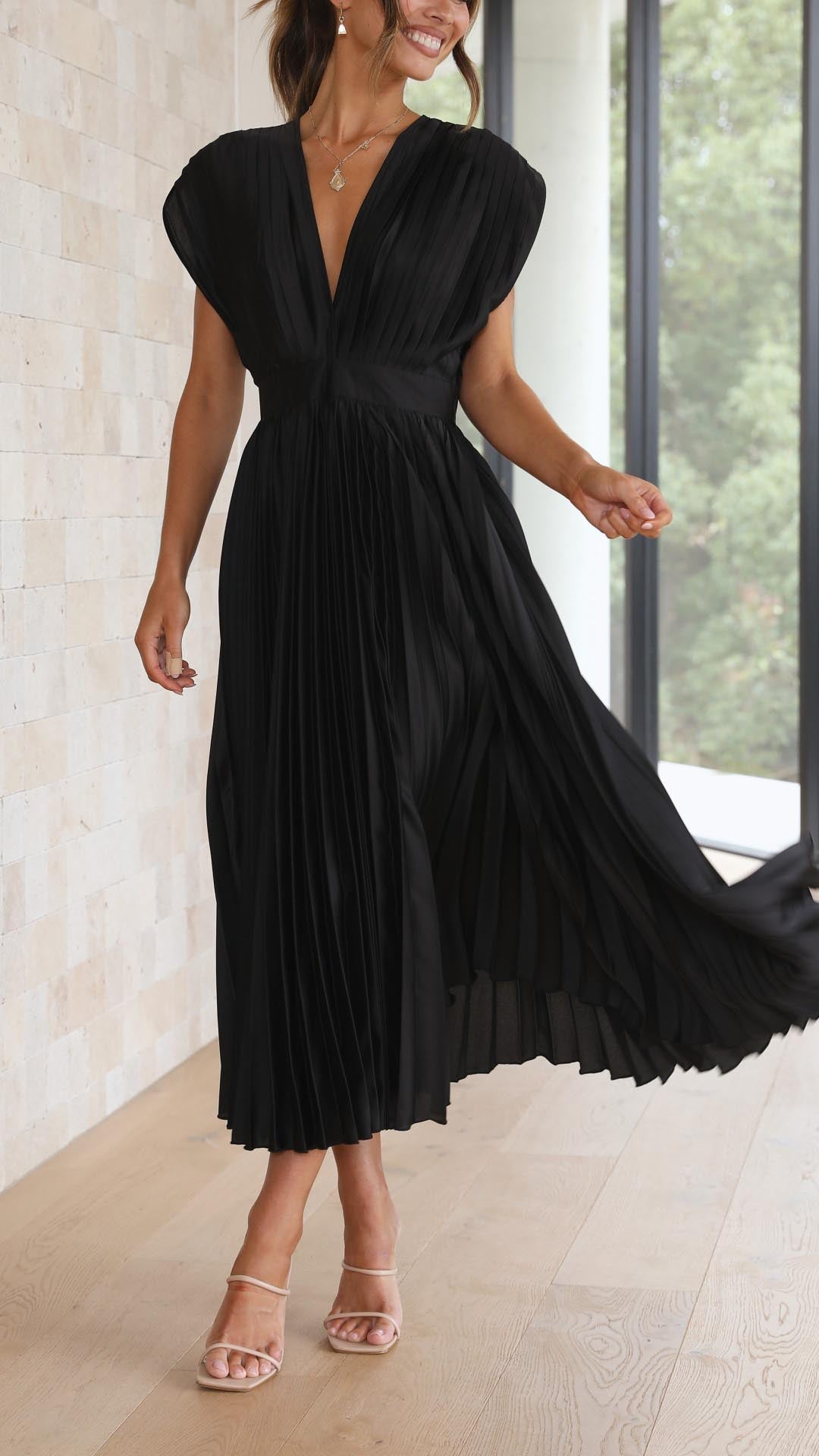 Black pleated sleeveless midi dress v-neckline flowing skirt detail