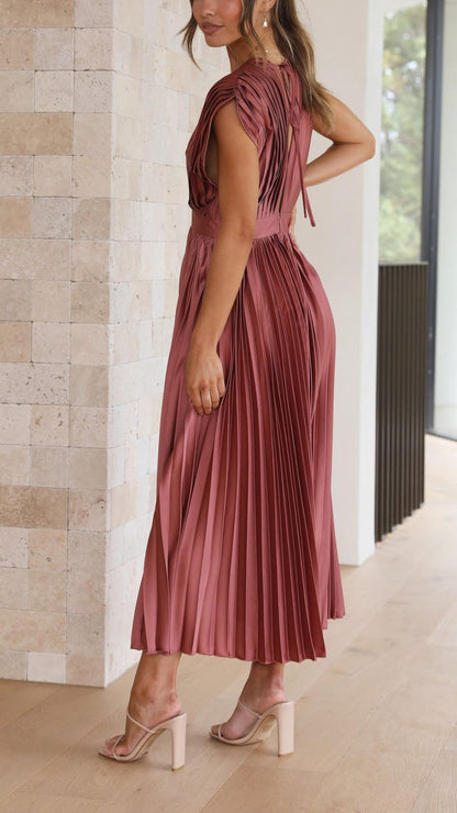 Back view of mauve sleeveless midi dress with open back detail and pleated skirt