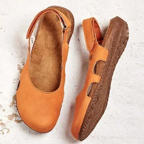 Tan leather adjustable sling back sandals with cork sole top and side view