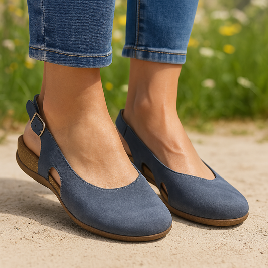 Navy blue adjustable sling back sandals with cork wedge heel worn with jeans