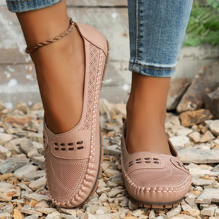 Beige loafer flat with textured upper and stitched rubber sole detail
