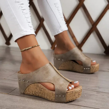 Beige studded cork platform wedge sandals with peep toe styling