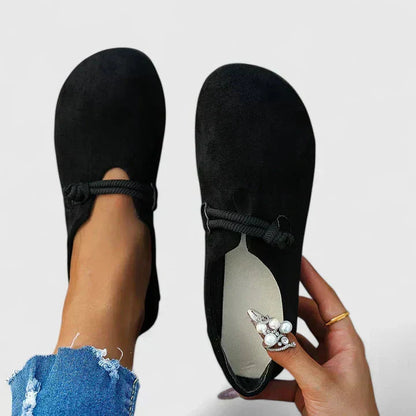 Black suede orthopedic loafer with rope trim detail, front and back view