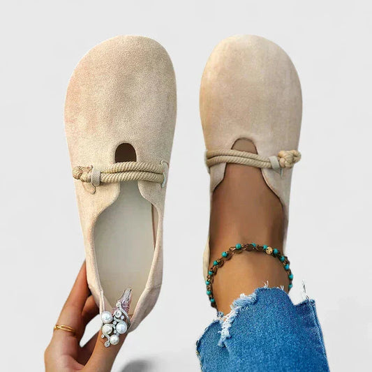 Beige suede slip-on loafer flats with rope detail, shown from top and side view