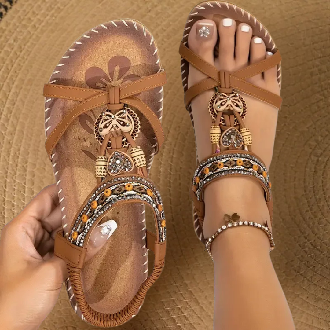 Tan leather orthopedic sandal with decorative charm and rhinestone ankle strap