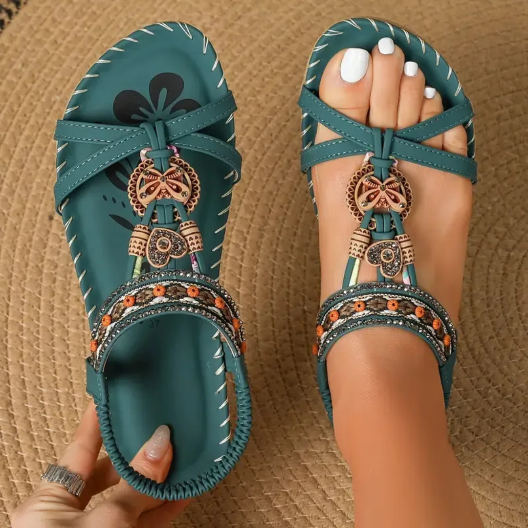 Teal orthopedic strappy sandal with decorative charm and beaded ankle band