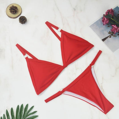 Red triangle bikini top with metal ring accents and adjustable straps
