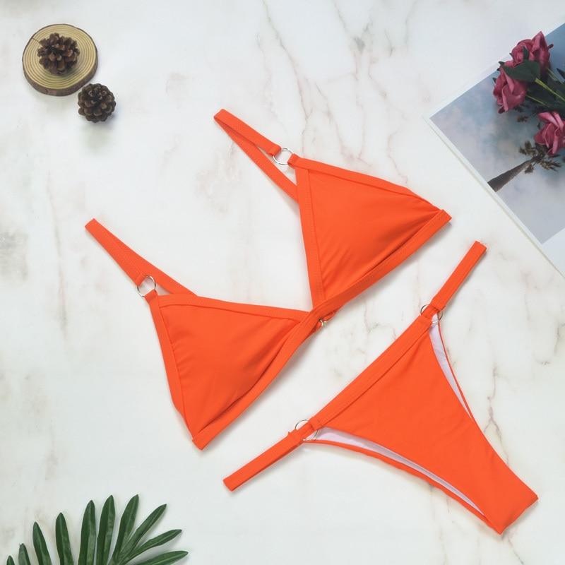 Bright orange triangle bikini set with metal ring details on straps
