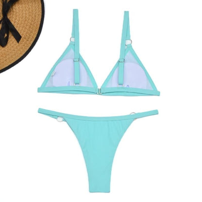 Turquoise triangle bikini with metal rings and lavender lining detail