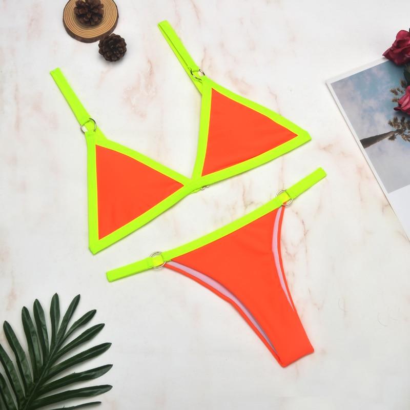 Neon yellow triangle bikini with orange center and metal ring straps