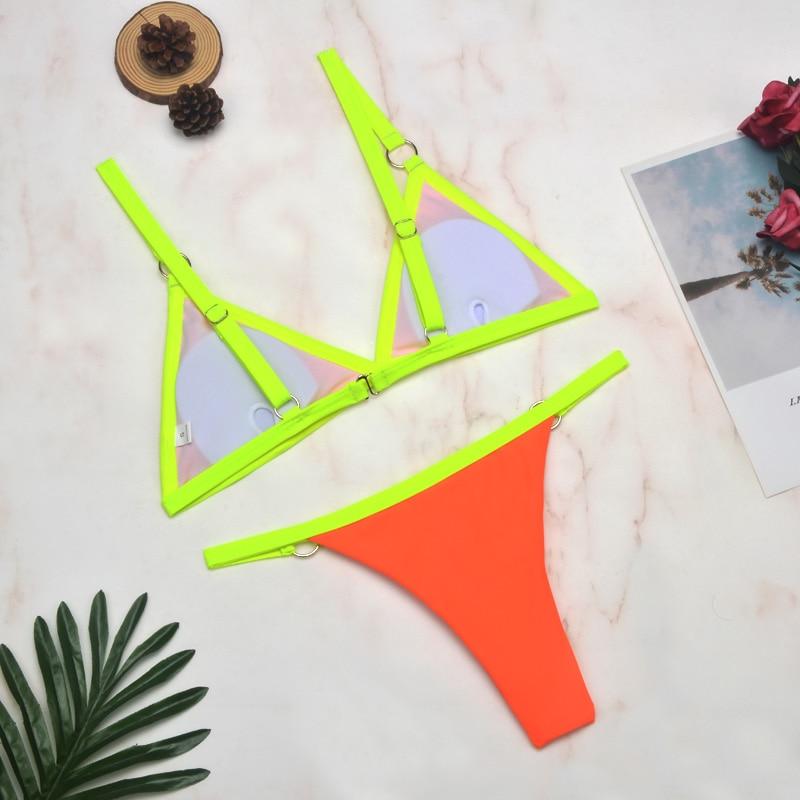 Neon yellow triangle bikini with lavender lining and metal ring accents
