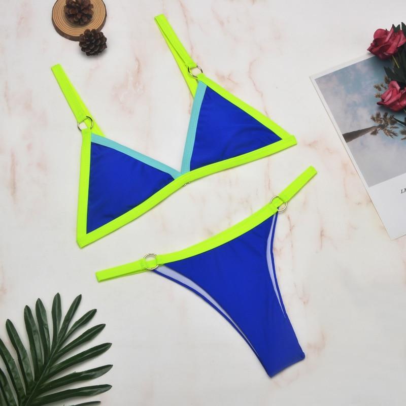 Neon yellow triangle bikini with navy blue center and metal rings