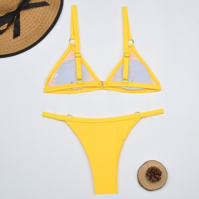 Yellow sheer triangle bikini with metal ring accents overhead view