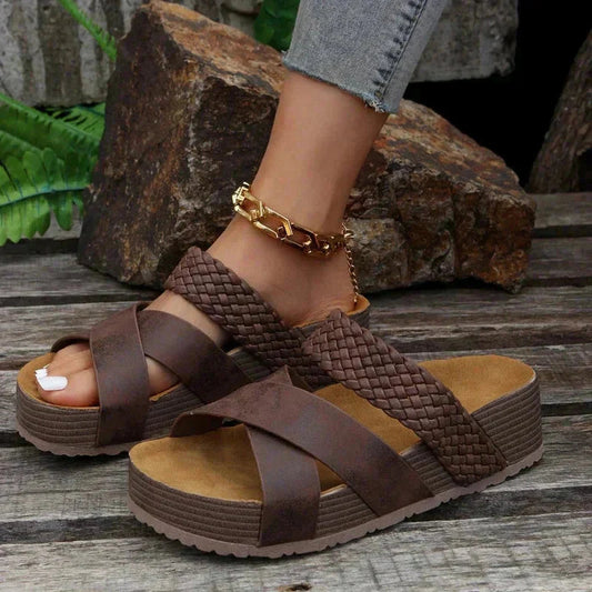 Brown woven platform sandal with contoured footbed and crossover strap