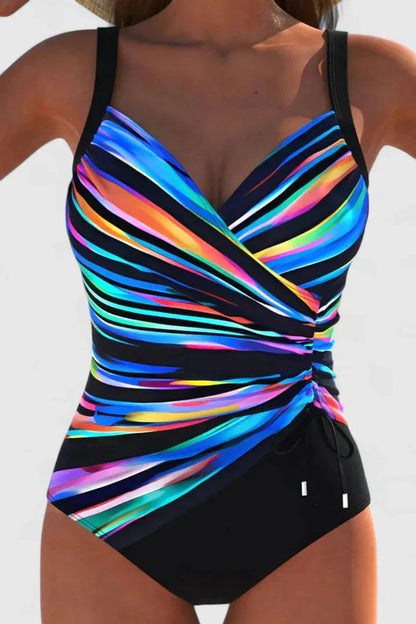 Neon rainbow striped wrap-front one-piece swimsuit with black sides