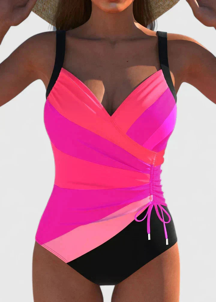 pink and magenta wrap-front one-piece swimsuit with black bottom
