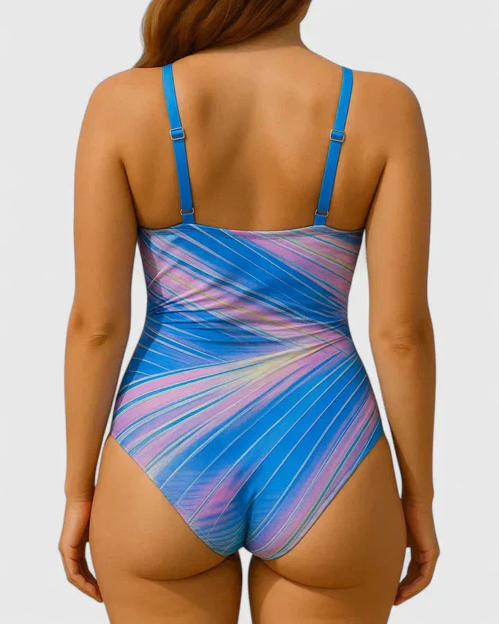 Back view of blue and pink striped wrap-front one-piece swimsuit
