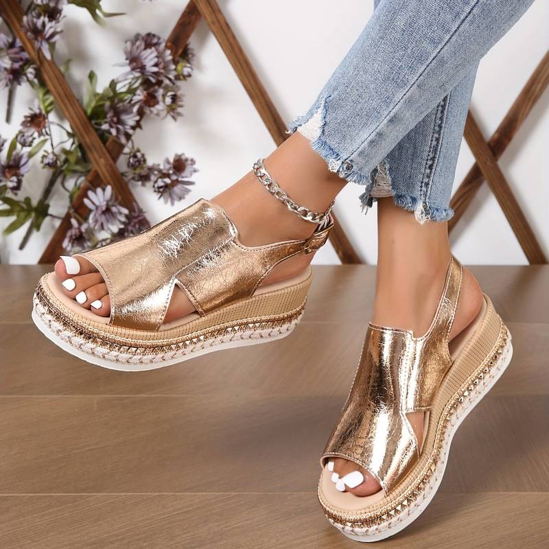 Champagne metallic peep toe platform sandal with textured base and cutout design