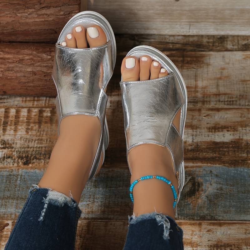 Silver metallic peep toe platform sandal overhead view showing textured upper and white sole