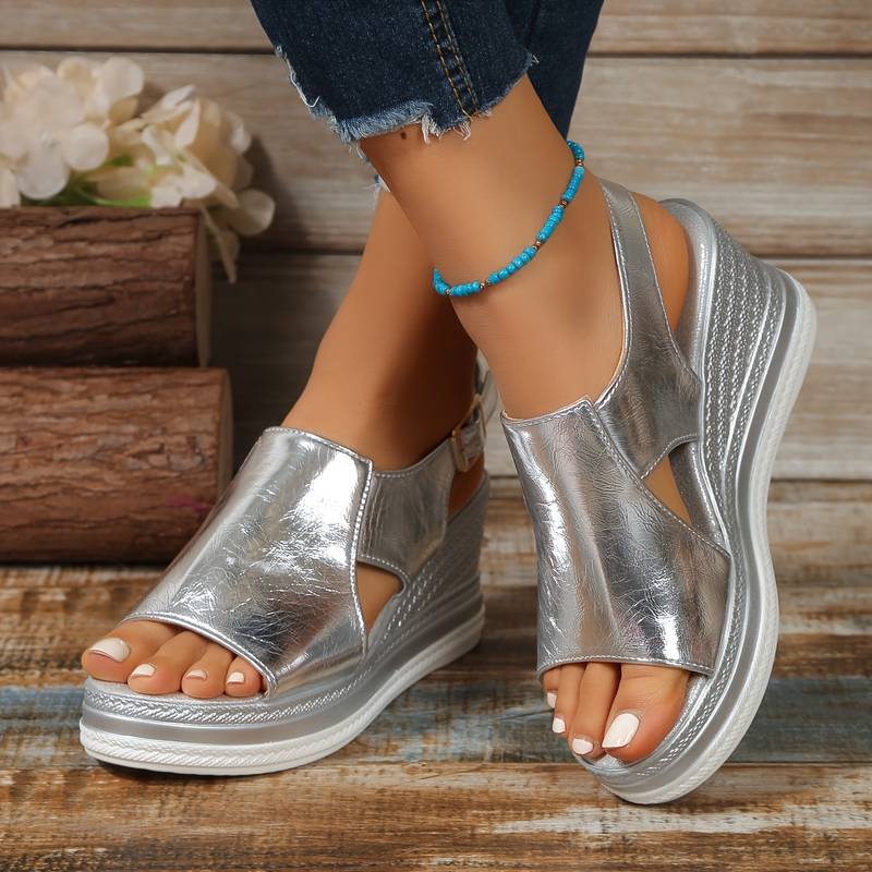 Silver metallic peep toe platform sandal with white sole and textured wedge
