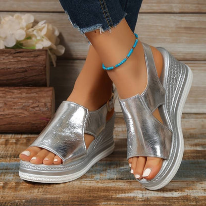 Silver metallic peep toe platform sandal with white sole and textured wedge
