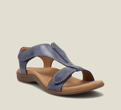 Navy blue t-strap orthopedic sandal with contoured arch support and soft lining