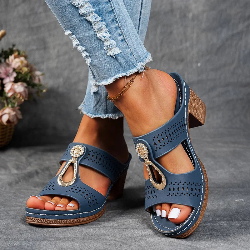 Navy perforated block heel sandal mule with gold decorative hardware and wooden heel