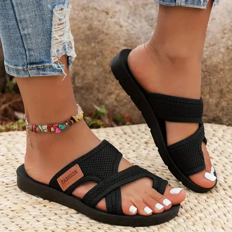 Black cushioned adjustable strap sandals with textured straps and padded sole