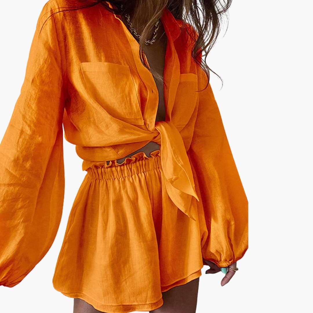 Burnt orange linen wrap crop top with billowing long sleeves and shorts ensemble