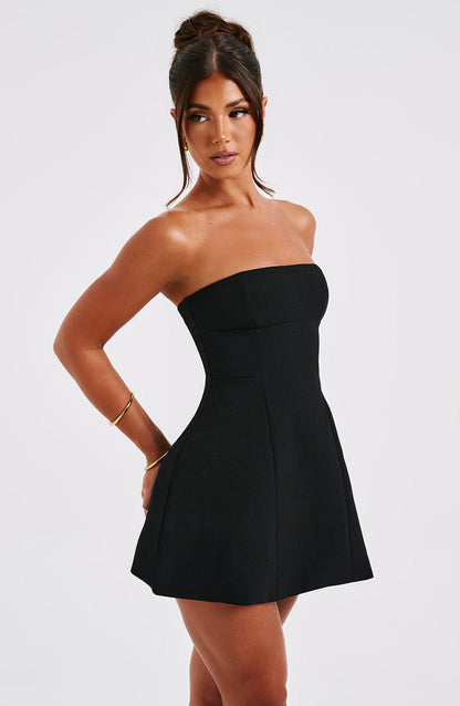 Black strapless bubble mini dress side view showing seamed structure